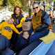 Grambling State University President Richard Gallot Jr. (right) rides in the homecoming parade in Grambling, La., with his wife, Christy, and sons. (Richard Gallot Jr.)